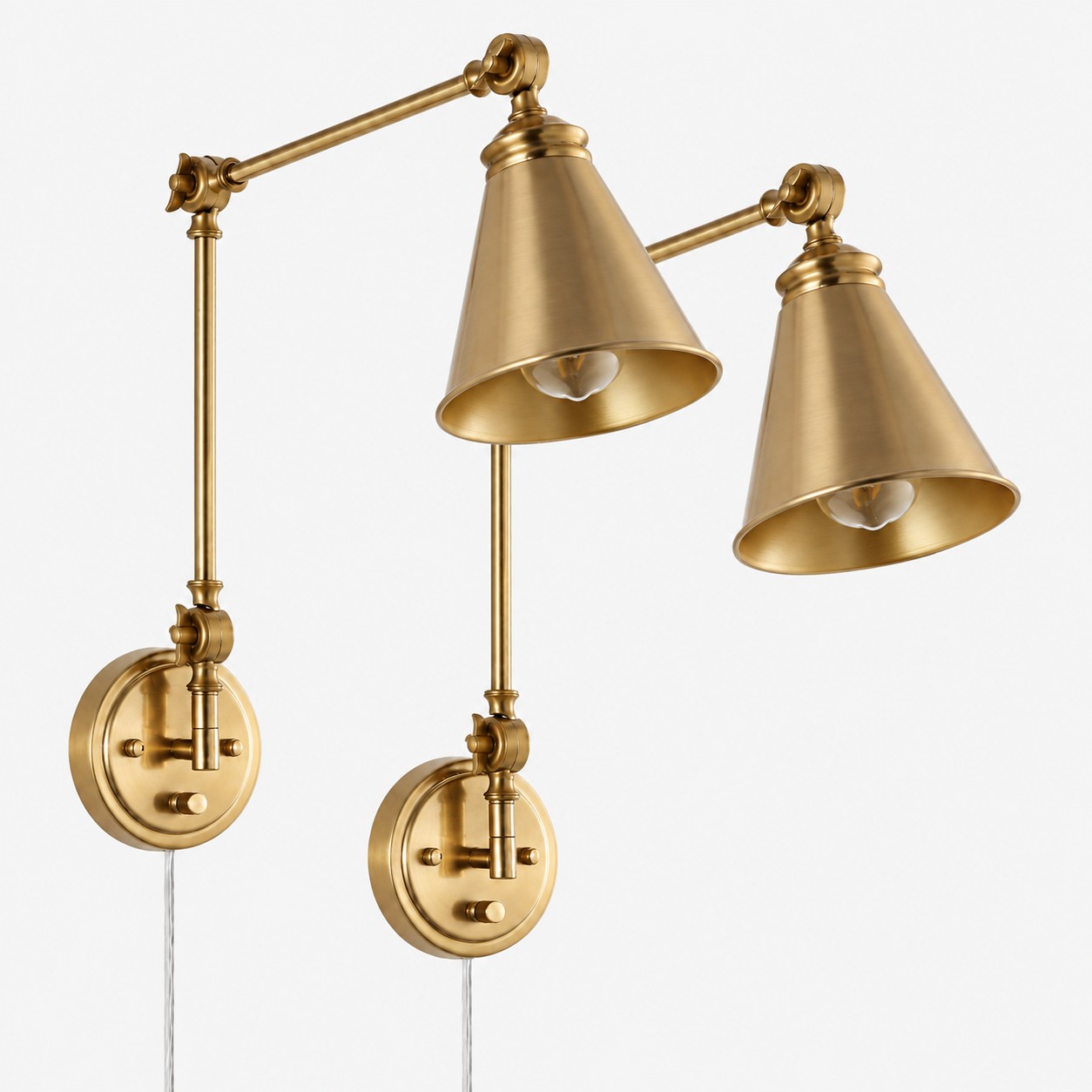 Pair of gold iron swing-arm sconces with cone shades