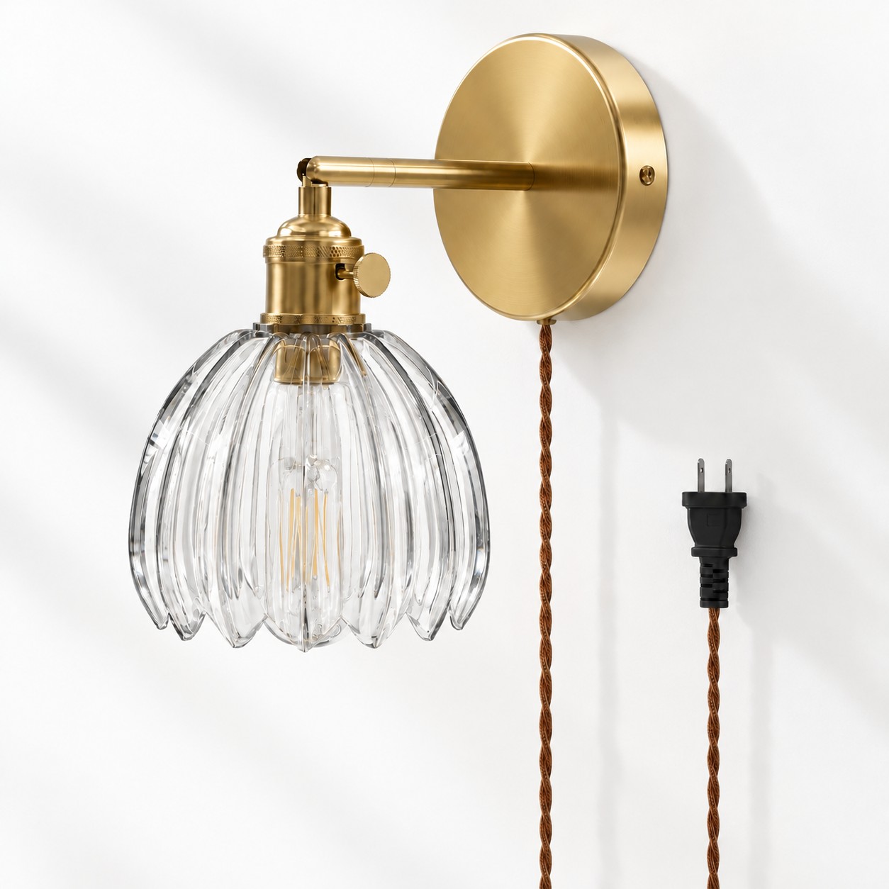 Clear tulip glass plug-in wall sconce